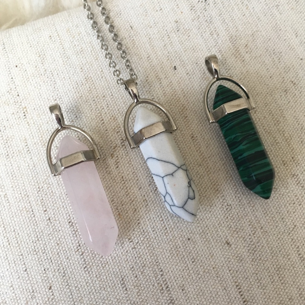 Three rock pendents with one silver chain